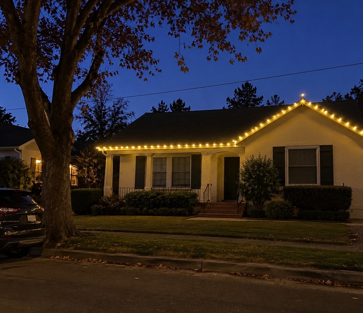 Christmas light installation in Fair Oaks, CA: grand stone stucco estate wrapped oaks c9 warm white